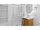 Bathroom featuring a sliding glass door shower, modern vanity, and built in shelving at 6660 Hidden Brook Trl, Atlanta, GA 30349