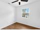 Bright bedroom features a large window and hardwood floors at 6660 Hidden Brook Trl, Atlanta, GA 30349