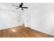 Bedroom featuring a ceiling fan, neutral walls, and hardwood floors at 6660 Hidden Brook Trl, Atlanta, GA 30349