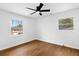 Bright bedroom with hardwood floors and windows providing natural light at 6660 Hidden Brook Trl, Atlanta, GA 30349