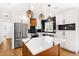 Bright kitchen with stainless steel appliances, custom cabinetry, and beautiful stone countertops at 6660 Hidden Brook Trl, Atlanta, GA 30349
