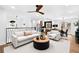 Bright living area with stylish furniture flowing into the kitchen, offering ample space for Gathering gatherings at 6660 Hidden Brook Trl, Atlanta, GA 30349
