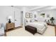 Bedroom showcasing a cozy sitting area, neutral colors, and lots of natural light at 6660 Hidden Brook Trl, Atlanta, GA 30349