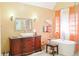 Modern bathroom featuring a glass shower, a free standing tub, and an elegant vanity at 7435 Woodruff Way, Stone Mountain, GA 30087
