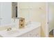 Bright bathroom featuring double sinks and a large mirror above the vanity at 7435 Woodruff Way, Stone Mountain, GA 30087