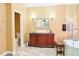 A modern bathroom with marble floors, a walk-in glass shower, and a vessel sink at 7435 Woodruff Way, Stone Mountain, GA 30087
