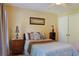 Cozy bedroom features soft lighting, a comfortable bed with decorative pillows, and ample closet space at 7435 Woodruff Way, Stone Mountain, GA 30087