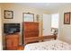 Bright bedroom showcasing hardwood floors, modern furnishings, and tasteful decor at 7435 Woodruff Way, Stone Mountain, GA 30087