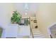 Bright home foyer showcasing a soaring ceiling, staircase, and stylish light fixture and interior design at 7435 Woodruff Way, Stone Mountain, GA 30087