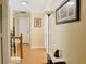 Bright hallway featuring hardwood floors and decorative artwork on the yellow-painted walls at 7435 Woodruff Way, Stone Mountain, GA 30087