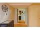 Basement hallway with updated lighting, painted walls, and access to multiple rooms at 7435 Woodruff Way, Stone Mountain, GA 30087