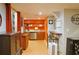This kitchen includes wooden cabinets, stainless steel appliances and is brightly lit at 7435 Woodruff Way, Stone Mountain, GA 30087