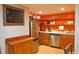Cozy kitchen with wooden cabinets, stainless steel appliances, and open shelving at 7435 Woodruff Way, Stone Mountain, GA 30087