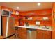 Bright kitchenette with stainless steel appliances, granite counters and plenty of storage space at 7435 Woodruff Way, Stone Mountain, GA 30087