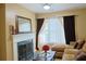 A comfortable living room with a fireplace and a chaise sectional couch at 7435 Woodruff Way, Stone Mountain, GA 30087