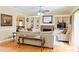 Bright living room showcasing built-in bookshelves, a brick fireplace, and a glass door to the outdoors at 7435 Woodruff Way, Stone Mountain, GA 30087