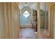 Bright bathroom features a tub-shower combination with a window and wood paneled walls at 75 Price Dr, Locust Grove, GA 30248