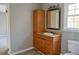 Bathroom with single vanity, granite countertop, and a mirrored medicine cabinet, offering ample storage at 75 Price Dr, Locust Grove, GA 30248