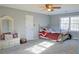 Bedroom with a bed, ceiling fan and a window for plenty of natural light at 75 Price Dr, Locust Grove, GA 30248
