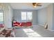 Bedroom with a bed, ceiling fan and a window for plenty of natural light at 75 Price Dr, Locust Grove, GA 30248