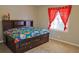 Bright and comfortable bedroom with a built-in headboard and plenty of natural light at 75 Price Dr, Locust Grove, GA 30248