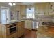 Kitchen boasts stainless appliances, an island with stone countertops, and lots of counter space at 75 Price Dr, Locust Grove, GA 30248