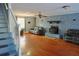 Bright and cozy living room with hardwood floors and stone fireplace, creating a warm atmosphere at 75 Price Dr, Locust Grove, GA 30248