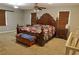 Spacious main bedroom featuring a ceiling fan, plenty of natural light, and comfortable furnishings at 75 Price Dr, Locust Grove, GA 30248