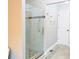 Modern shower stall with glass doors and tiled walls, offering a clean and stylish design at 75 Price Dr, Locust Grove, GA 30248