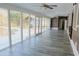 Bright sunroom with wall-to-wall windows overlooking a pool and outdoor area at 75 Price Dr, Locust Grove, GA 30248