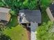 Birds-eye view of a home with a two-car garage, showcasing its well-maintained roof and surrounding greenery at 975 Memory Ln, Lawrenceville, GA 30044