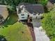 Overhead shot of the two-story home featuring a two-car garage, driveway and landscaped yard at 975 Memory Ln, Lawrenceville, GA 30044