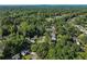Residential neighborhood aerial shot featuring wooded areas, streets and beautiful homes on large lots at 975 Memory Ln, Lawrenceville, GA 30044