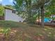 A view of the back of the house and the large grassy back yard at 975 Memory Ln, Lawrenceville, GA 30044