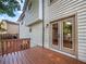 A wood deck with access to the house through double doors at 975 Memory Ln, Lawrenceville, GA 30044