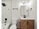 Bathroom with modern shower head, fixtures, and wooden vanity with marble countertop at 975 Memory Ln, Lawrenceville, GA 30044