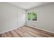 Bedroom featuring a spacious closet, neutral walls and hardwood floors throughout at 975 Memory Ln, Lawrenceville, GA 30044