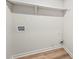 Bright room with sleek light hardwood flooring and white shelving at 975 Memory Ln, Lawrenceville, GA 30044