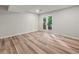 Bright room with hardwood flooring and white french doors leading to an outdoor deck at 975 Memory Ln, Lawrenceville, GA 30044