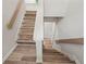 Beautiful stairway with wood treads and white risers, showcasing the home's clean and modern design at 975 Memory Ln, Lawrenceville, GA 30044