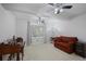 Bright home office with a desk, sleeper sofa, and ample natural light at 138 Elysian Nw Way, Atlanta, GA 30327