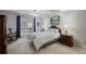 Relaxing bedroom with light-filled french doors and a calming color palette at 138 Elysian Nw Way, Atlanta, GA 30327