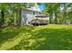 Home's backyard features a deck and expansive green space at 174 Rivertown Rd, Fairburn, GA 30213