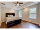 Inviting bedroom with hardwood floors, recessed lights, ceiling fan and ample natural light for a calm ambience at 174 Rivertown Rd, Fairburn, GA 30213