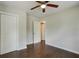 Bedroom boasts hardwood floors, neutral paint, and double door closet at 174 Rivertown Rd, Fairburn, GA 30213