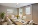 Dining room with table, chairs, and decor with natural light at 174 Rivertown Rd, Fairburn, GA 30213