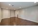 Spacious room with hardwood floors, featuring fresh paint, recessed lighting, and closet space at 174 Rivertown Rd, Fairburn, GA 30213