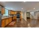 An open, updated kitchen featuring stainless steel appliances and modern lighting at 174 Rivertown Rd, Fairburn, GA 30213