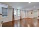 Bright and airy living room with hardwood floors and large windows at 174 Rivertown Rd, Fairburn, GA 30213