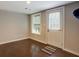 Room with hardwood floors, window, and a door leading outside at 174 Rivertown Rd, Fairburn, GA 30213
